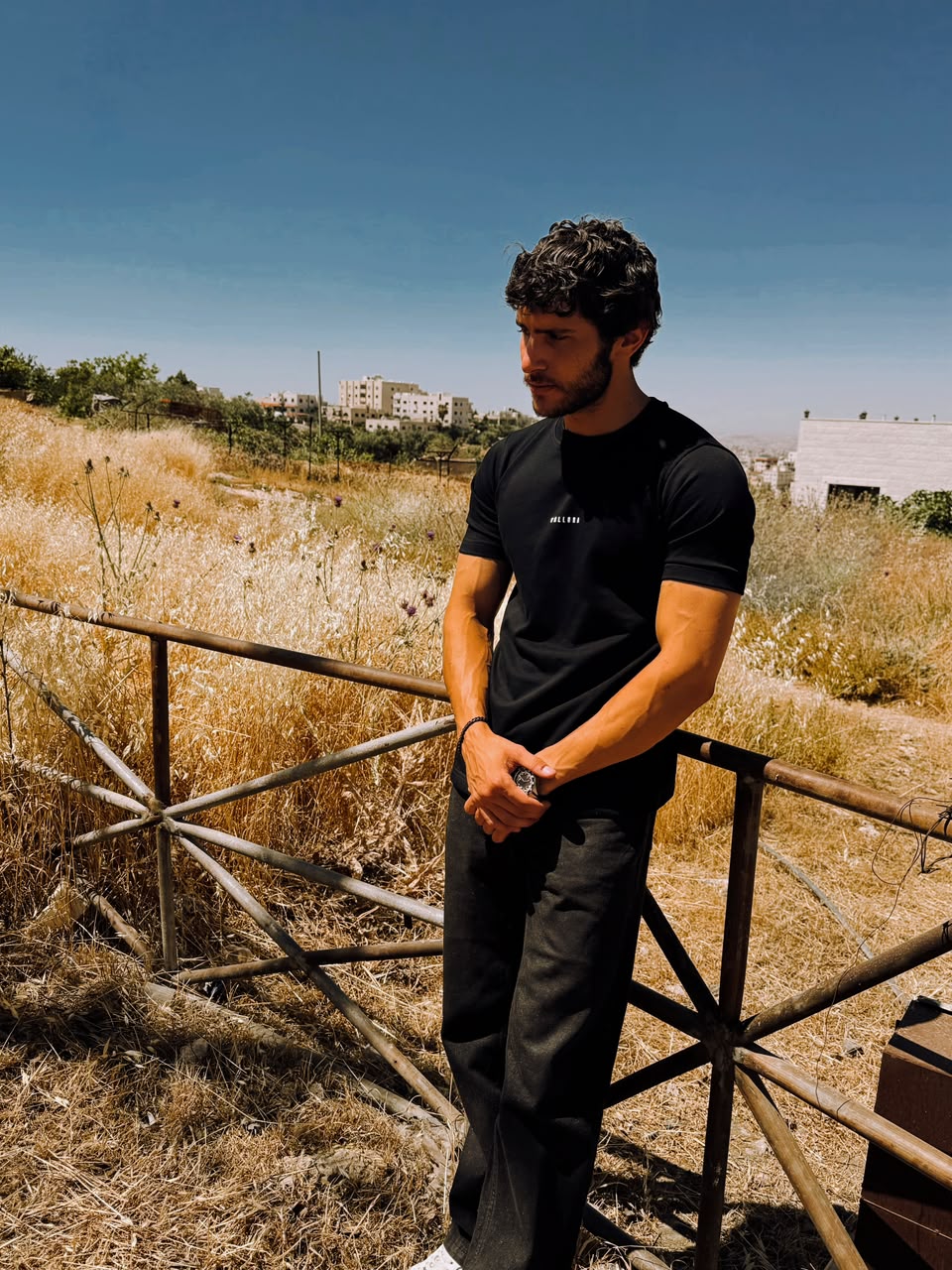 Front of the black tee standing in open ground